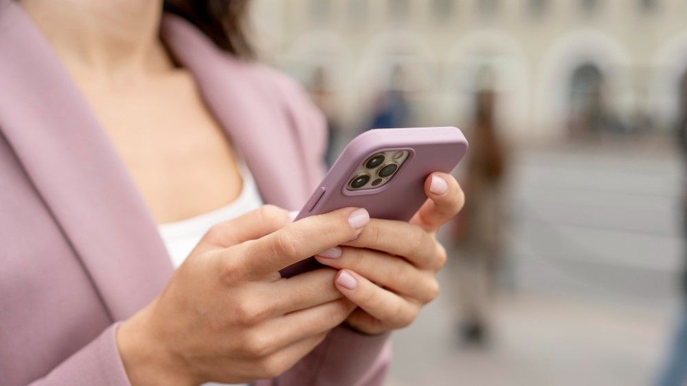 close-up-hands-holding-smartphone.jpg