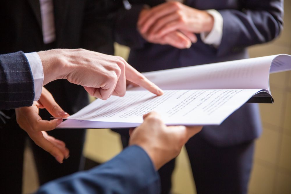 cropped-view-of-businesswomen-reading-document.jpg