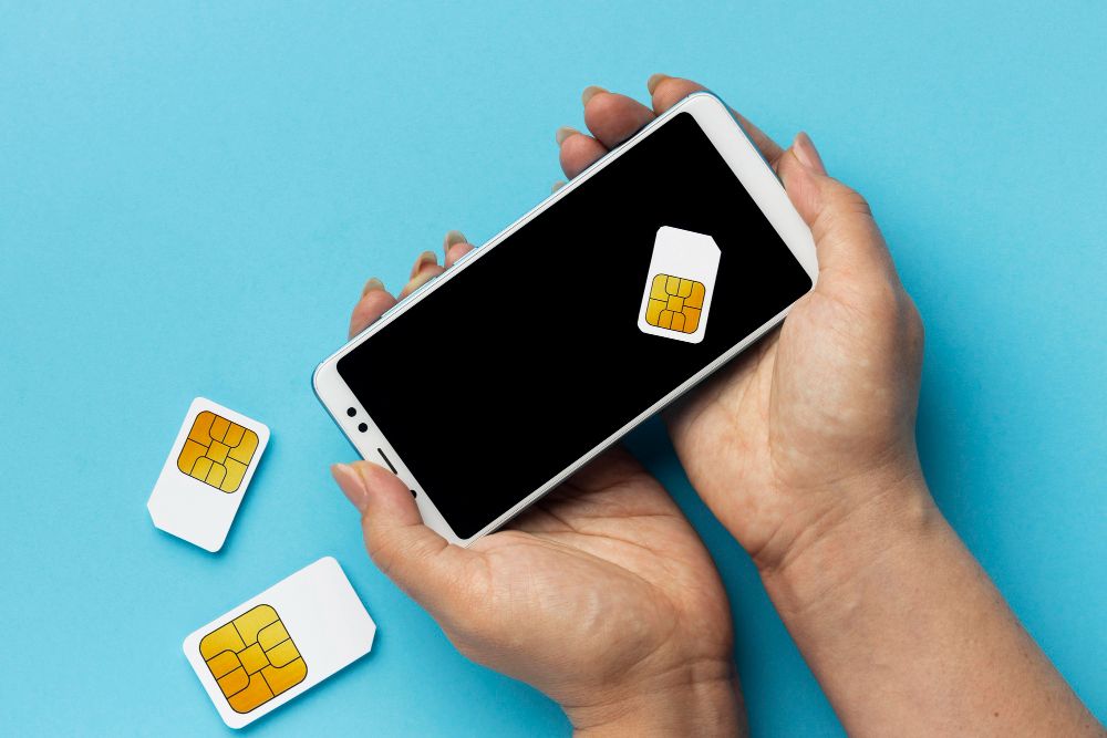 front-view-of-hands-holding-smartphone-sim-cards.jpg